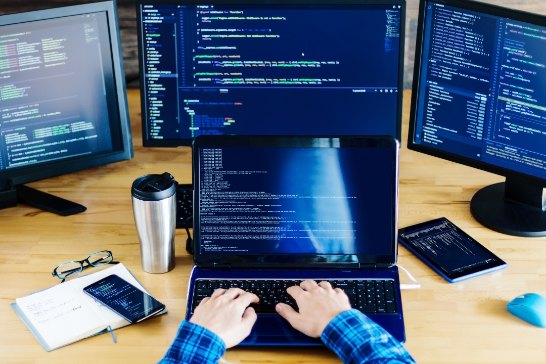 Illustration of a freelance developer working on a laptop, showing steps to land their first freelance project.